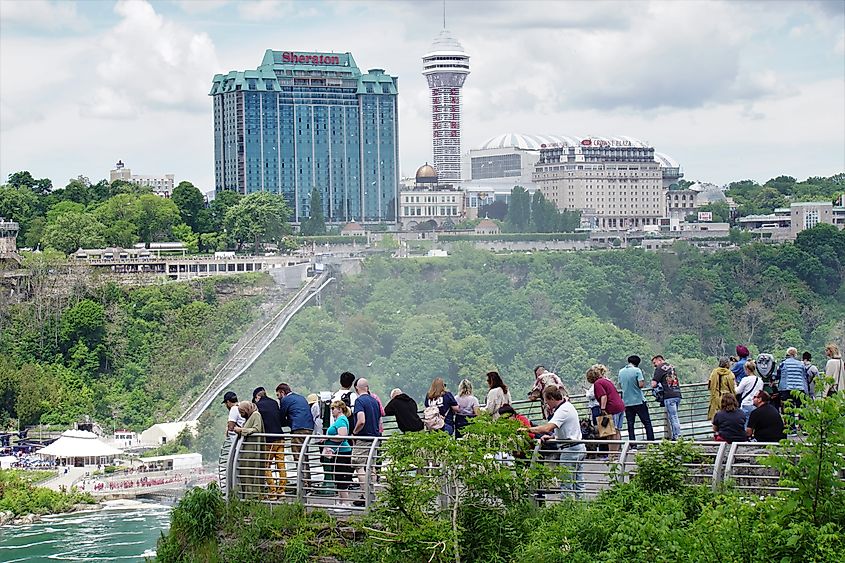 Tourists gathered at an observation area on Luna Island in Niagara Falls State Park, New York.