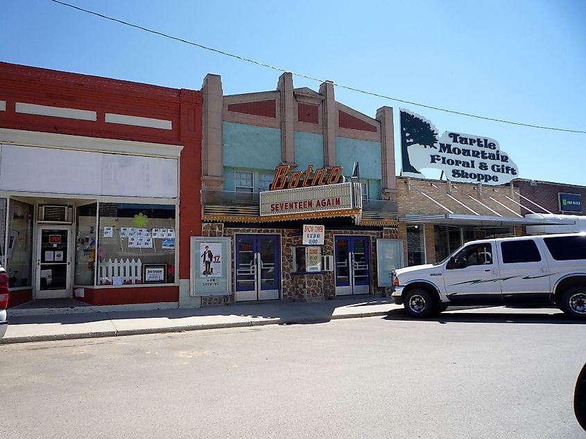 The Botno Theater amidst small businesses in the town of Bottineau, North Dakota.