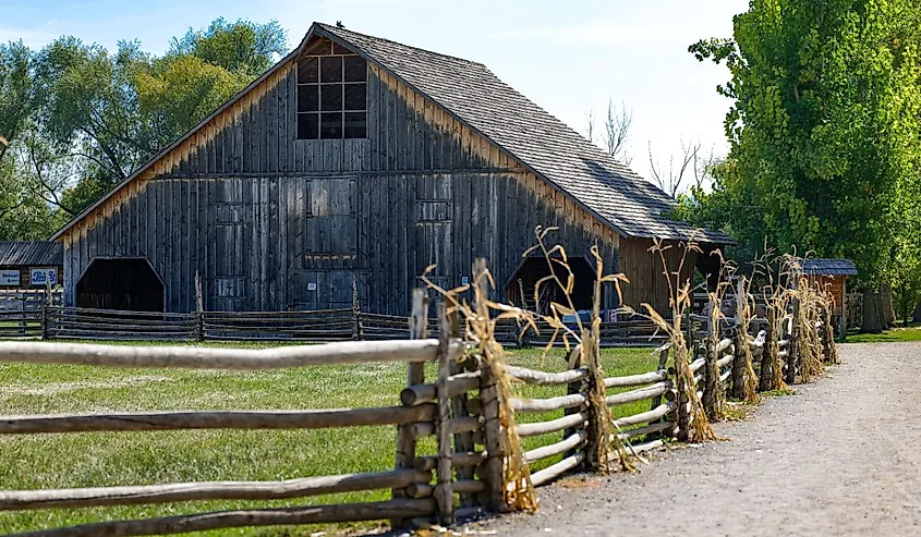 A beautiful shot of a barn and a wooden fence in Wellsville, Utah.