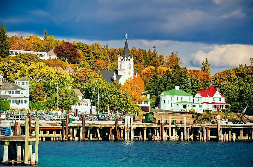 Lake house along Lake Huron surrounded by vibrant autumn foliage on Mackinac Island, Michigan