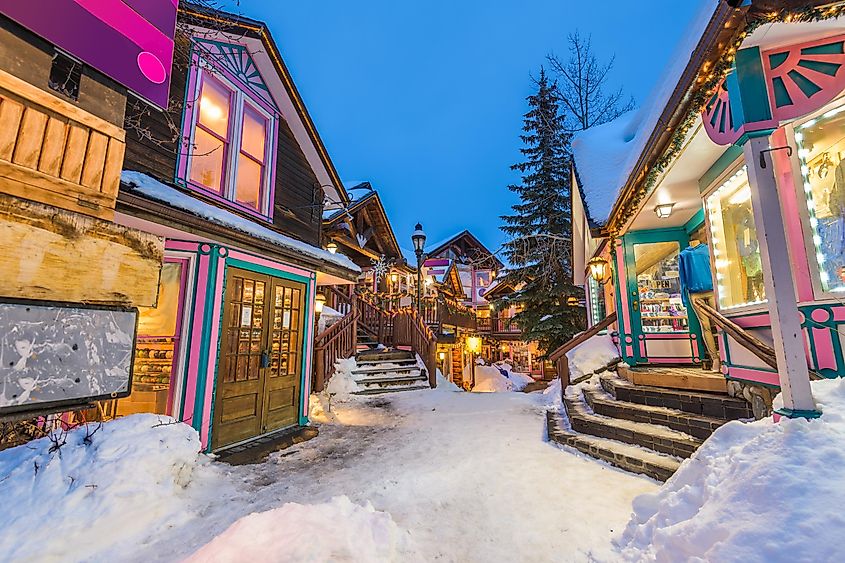 Breckenridge, Colorado, downtown streets at night in the winter with holiday lighting.