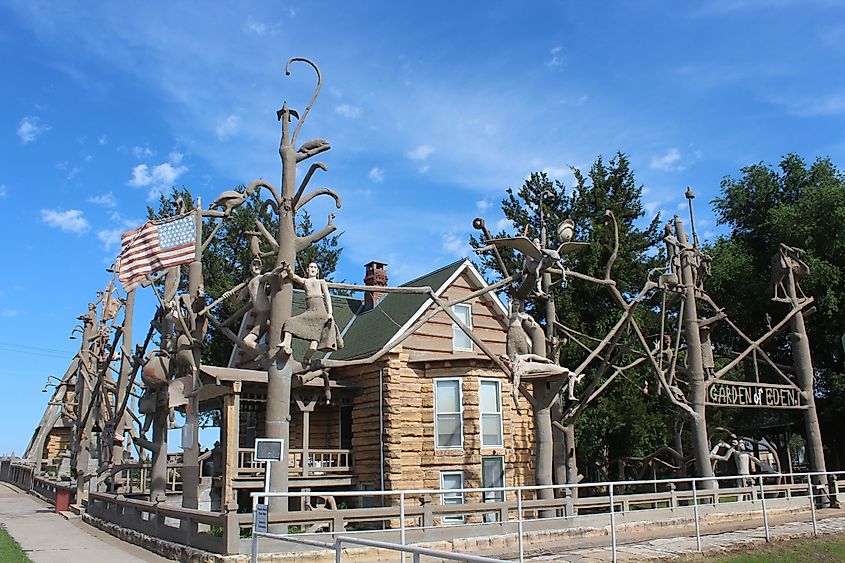 The Garden of Eden in Lucas, Kansas, with a blue sky and white clouds.