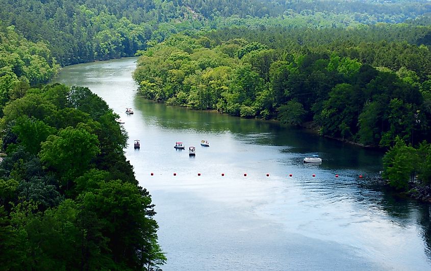 The beautiful Ouachita River flowing below Blakely Dam, with the clear waters transitioning from Lake Ouachita into Lake Hamilton, Arkansas