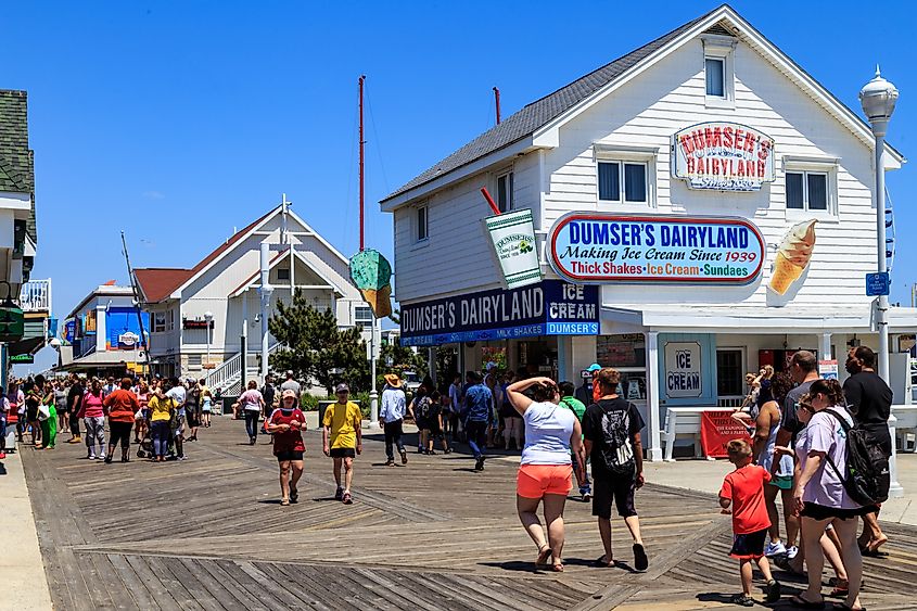 Stores, shops, and eateries attract visitors on the Ocean City boardwalk. Editorial credit: George Sheldon / Shutterstock.com