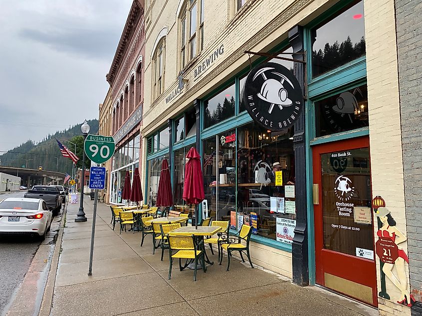 The entrance to Wallace Brewing Co, marked by a mining helmet and a scantily-clad female statue stating the age-limit.