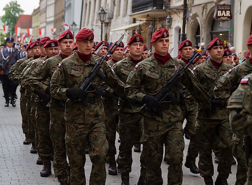 Polish soldiers march through Krakow in 2022. Credit Shutterstock: Longfin Media.