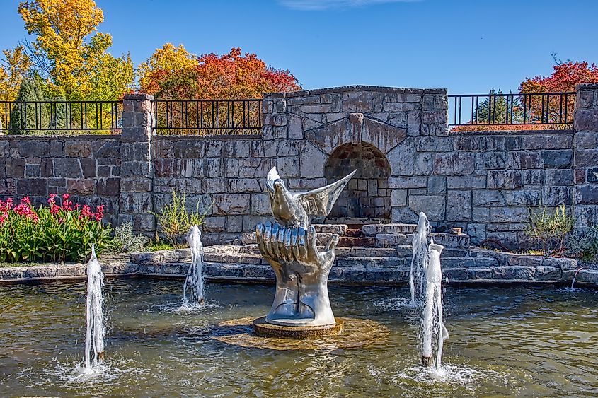 The International Peace Garden, spanning the border between North Dakota, USA, and Manitoba, Canada, featuring well-manicured gardens and symbolic monuments.