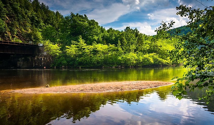 Evening clouds reflections in the Lehigh River, at Lehigh Gorge State Park, Pennsylvania.