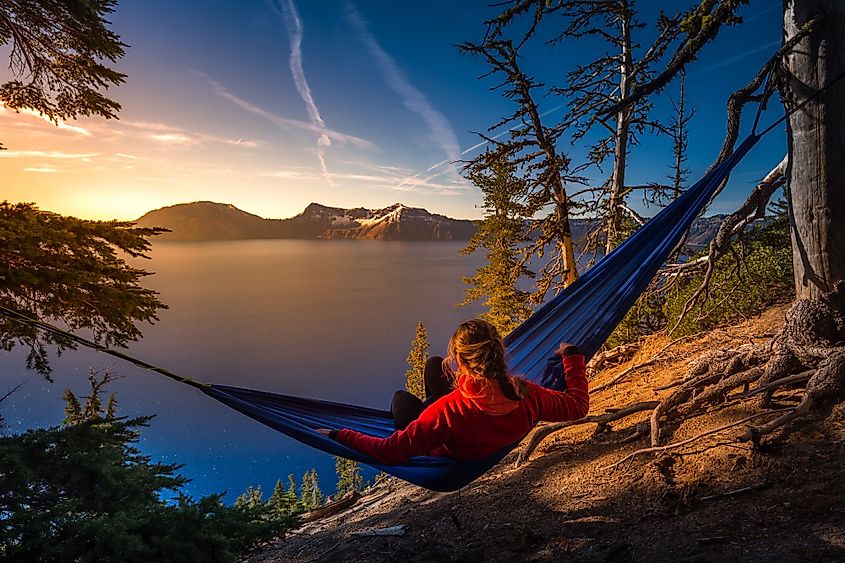A woman hiker relaxing in Crater Lake National Park, Oregon