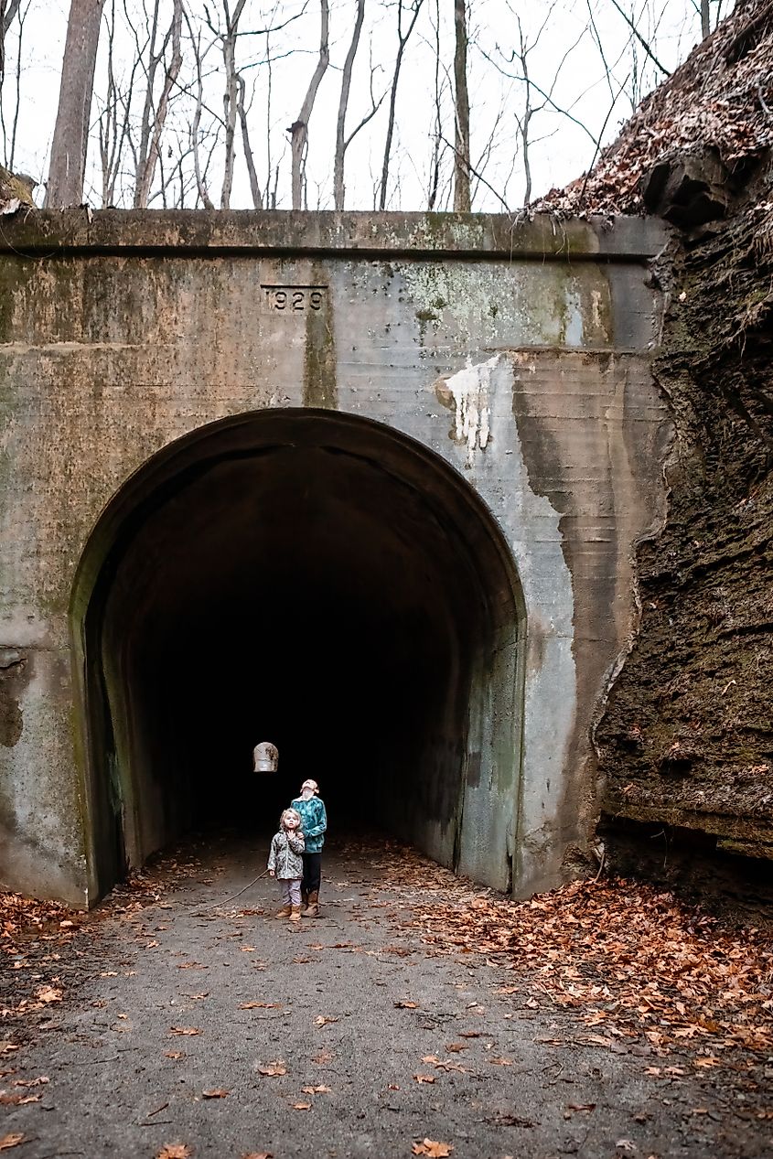 Kids standing at underground tunnel entrance on Tunnel Hill State Trail