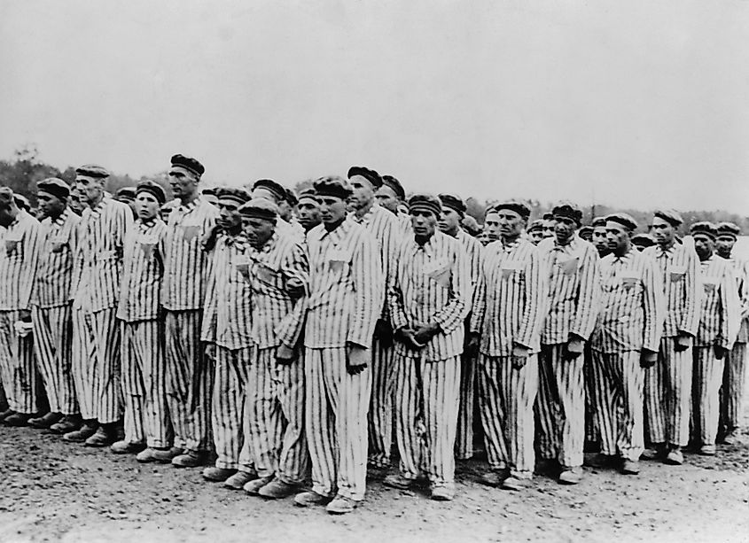 Buchenwald Concentration camp roll call - Two prisoners support a fainting peer to prevent execution, circa 1938-1941. Source: Everett Collection