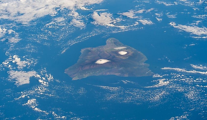 The big island of Hawaii and its two snow-capped volcanos, the active Mauna Loa and the dormant Mauna Kea pictured from the International Space Station