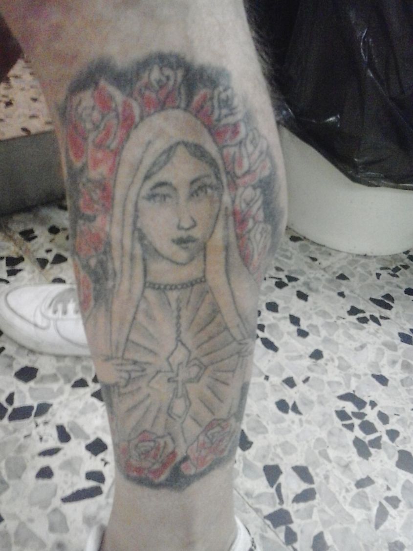 Photographed near Rome, Italy, this tattoo displays the Virgin Mary, a religious icon in Catholicism. Source: Wikimedia/Nicholas Gemini