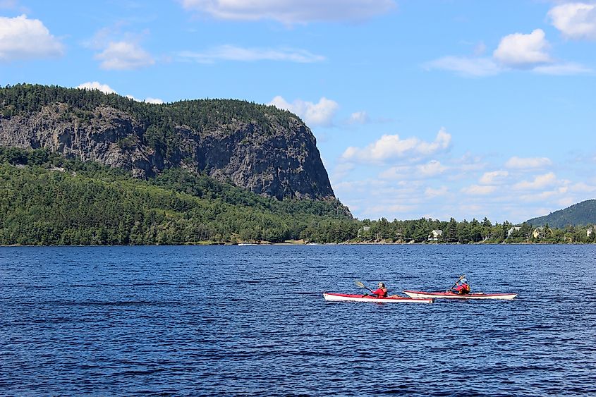 People kayaking on Moosehead Lake in Maine.