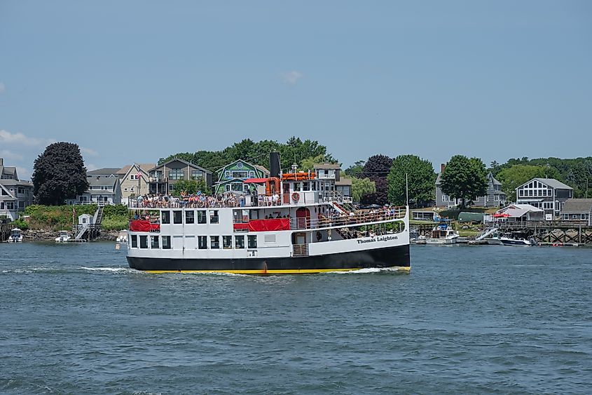 The Isles of Shoals Steamship Company vessel passing under the Memorial Bridge in Portsmouth, New Hampshire.