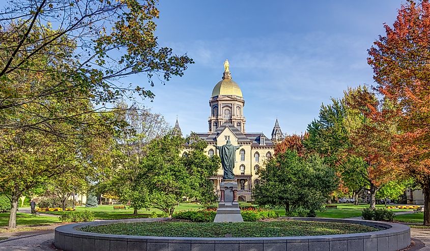 Jesus Statue and Golden Dome on the campus of Notre Dame University in the fall.