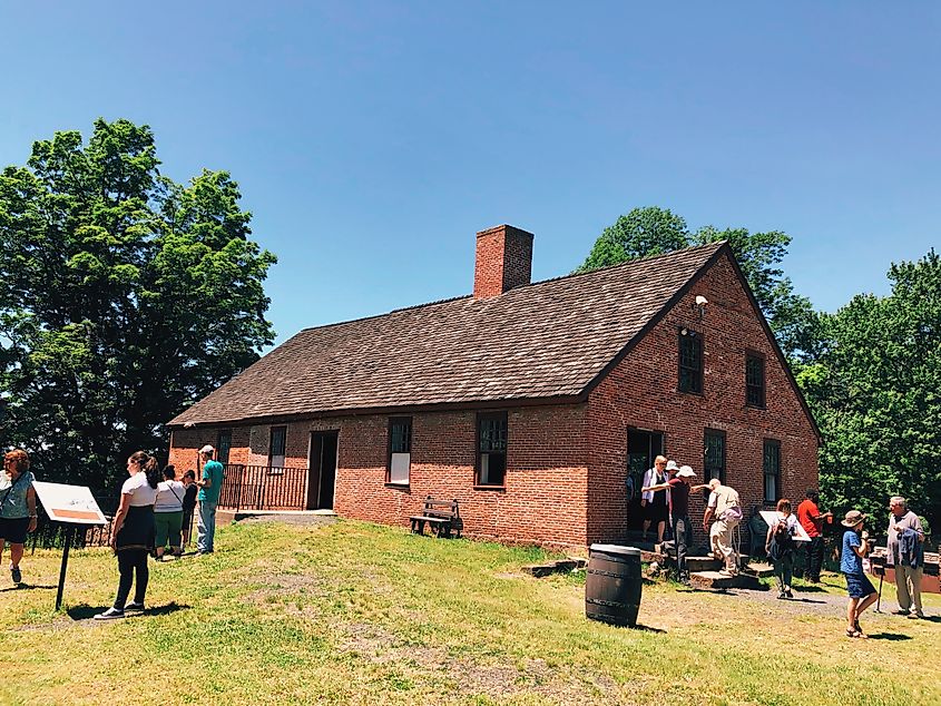Editorial Photo Credit: Shanshan0312 via Shutterstock. Granby,Connecticut,United States.June 8th,2019.People visiting Old Newgate Prison that is a former prison and mine site on Newgate Road in East Granby, Connecticut,United States.
