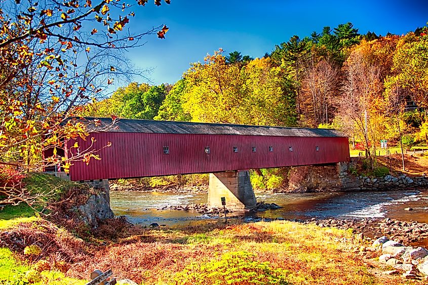 A covered bridge across the Houstanic River in Connecticut