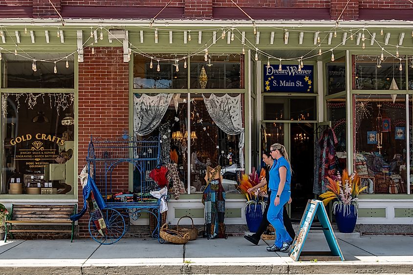 People walk past a craft store in Berlin, Maryland.