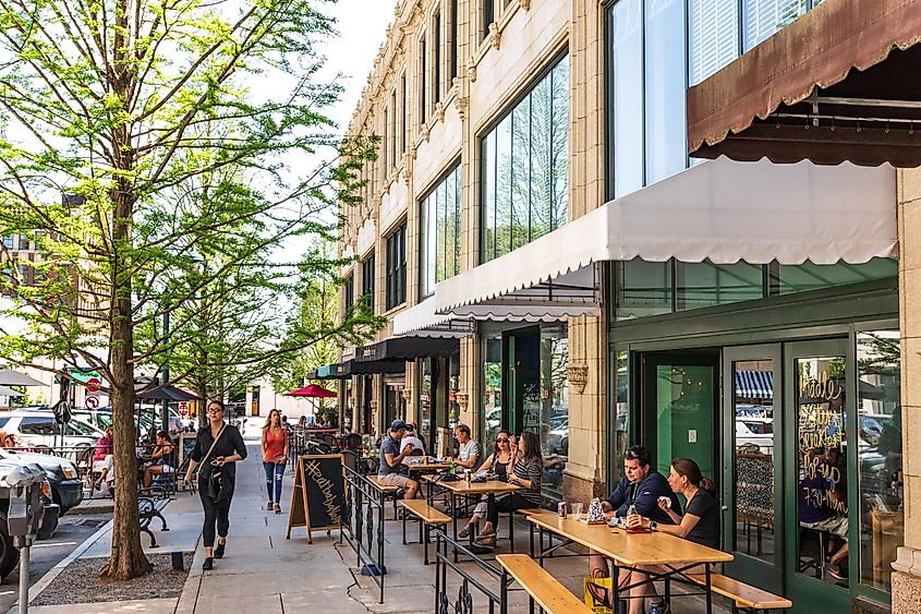 iners relaxing on Page Ave. in downtown Asheville, NC, USA on a warm, sunny spring day, via Nolichuckyjake / Shutterstock.com