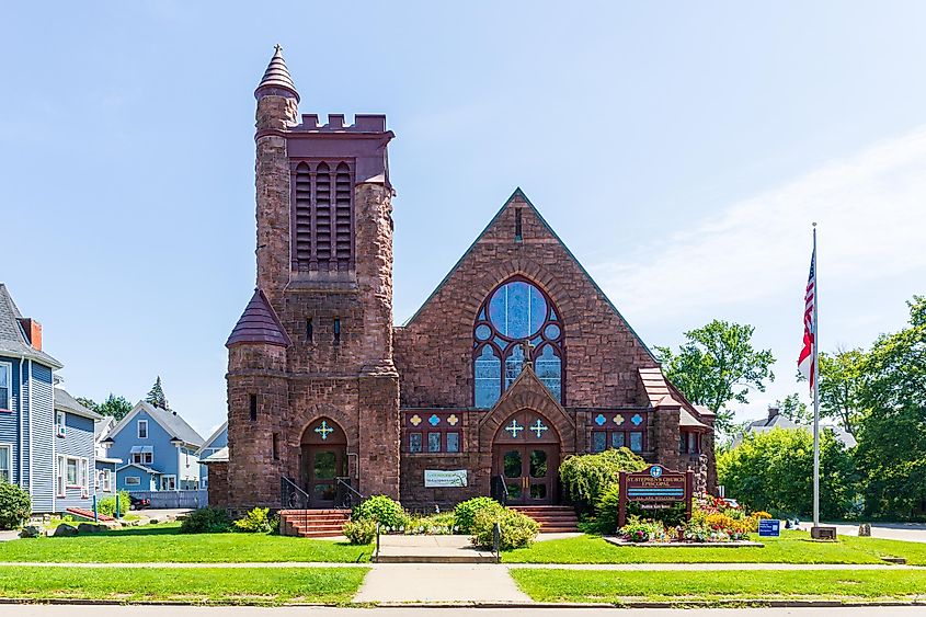 OLEAN, NY, USA-14 AUGUST 2021: St. Stephens Episcopal Church in downtown. Facade and landscaped lawn.