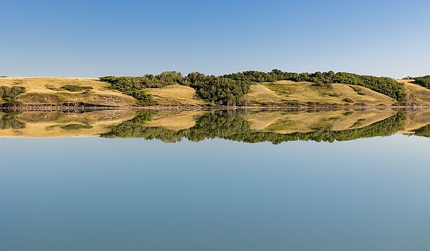 Reflection in Little Manitou Lake, Saskatchewan, Canada across from Manitou Beach and hot springs