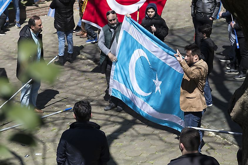 A man carrying the Turkmen Flag