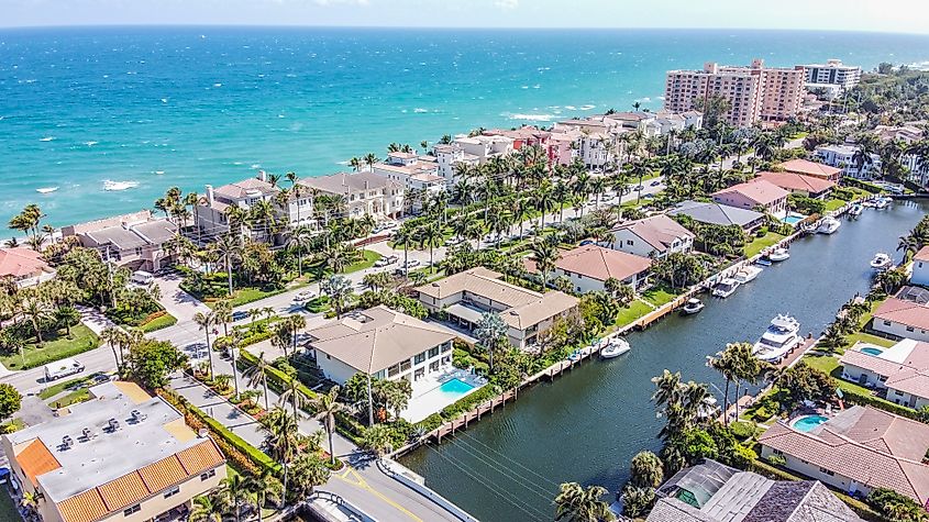 Aerial view of Highland Beach, Florida, showcasing the pristine coastline with sandy beaches, turquoise waters, and luxury homes lining the shore.