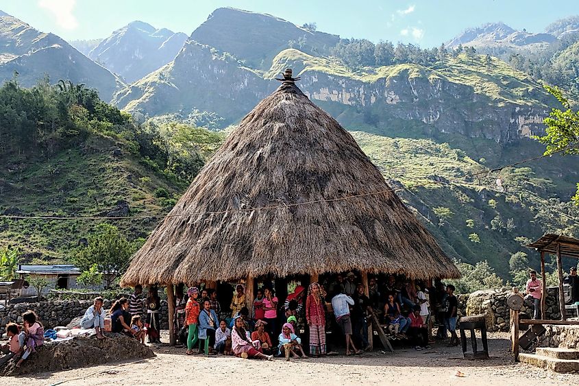 Local community gathering at traditional cultural house in East Timor, Southeast Asia. Shutterstock.com.