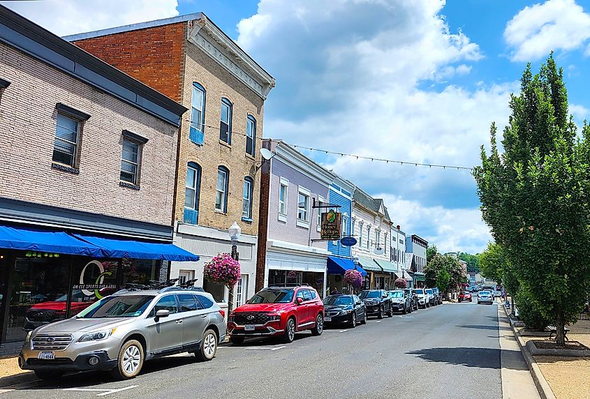 A street scene in Front Royal, Virginia, featuring historic buildings, local shops, and a picturesque small-town atmosphere.