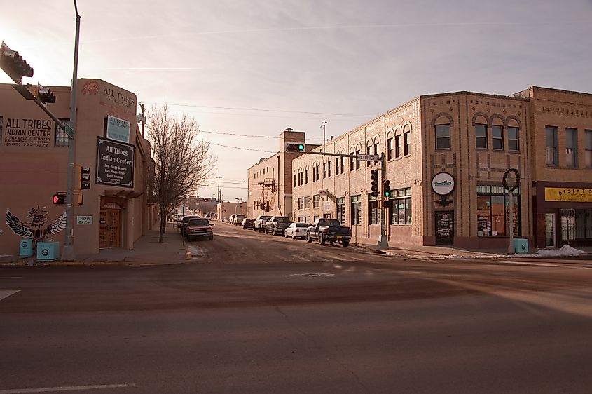 Intersection of S 1st St and Route 66 in downtown Gallup, New Mexico, with the All Tribes Indian Center on the left and Trade N Post Classifieds on the right.