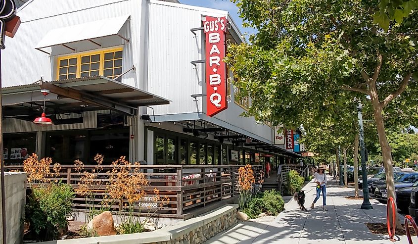 A store front sign for the barbecue restaurant known as Gus's BBQ, located at the Claremont Packing House.