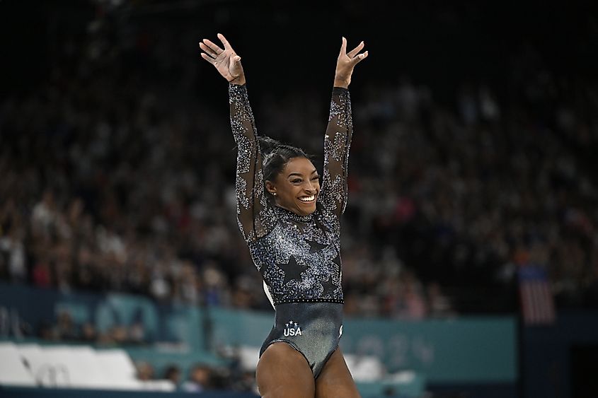 Simone Biles performs with the US gymnastics team at the Paris Olympics.