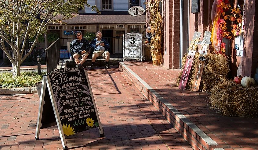 Outdoor decorations with a seasonal harvest theme make an inviting entrance to a gift shop in the downtown historic district of Dahlonega, Georgia.