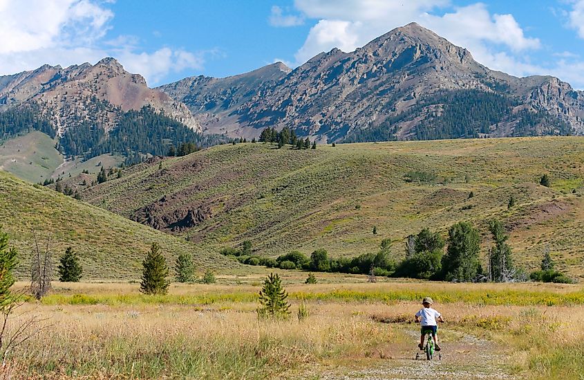 A child cycling in the mountains near Ketchum, Idaho.