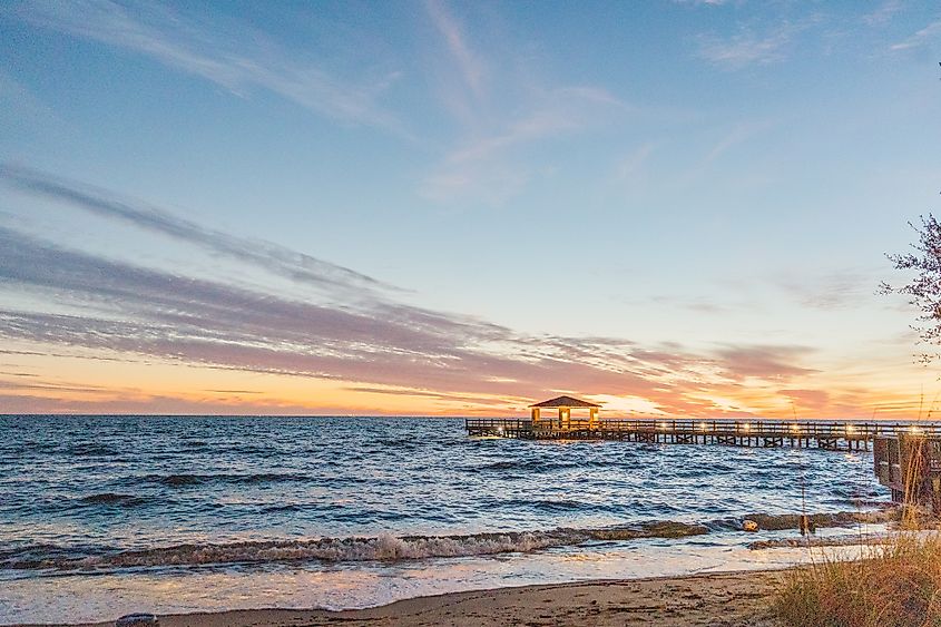 A pier in Gulf Shores, Alabama, during a beautiful sunset