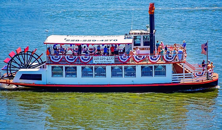 The Betsy Ann riverboat passes between Biloxi Small Craft Harbor and Deer Island