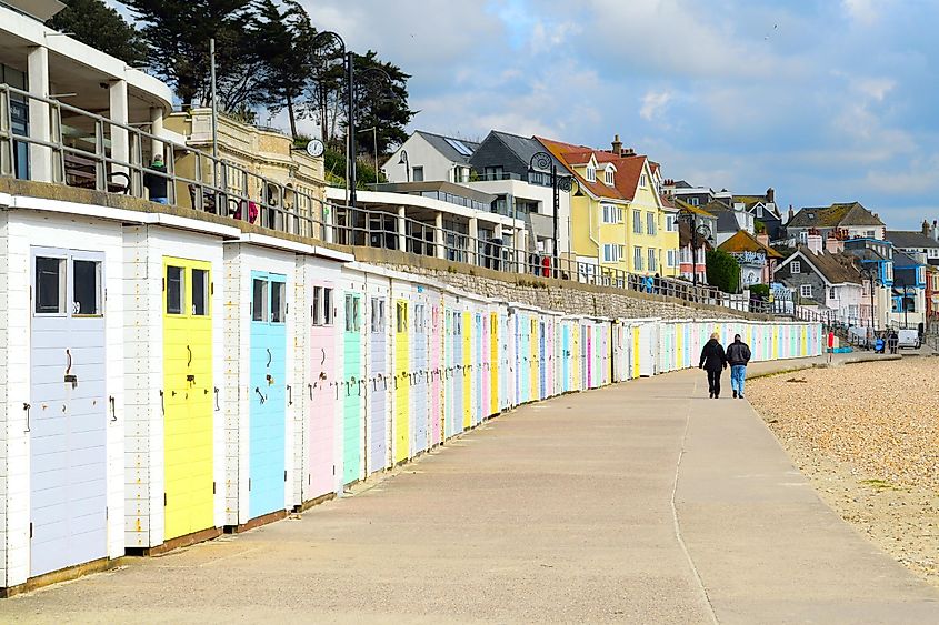 Colorful beach huts in coastline town Lyme Regis, England