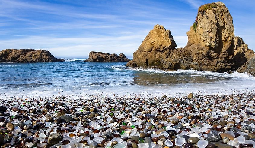 Colorful glass pebbles blanket this beach in Fort Bragg, California.