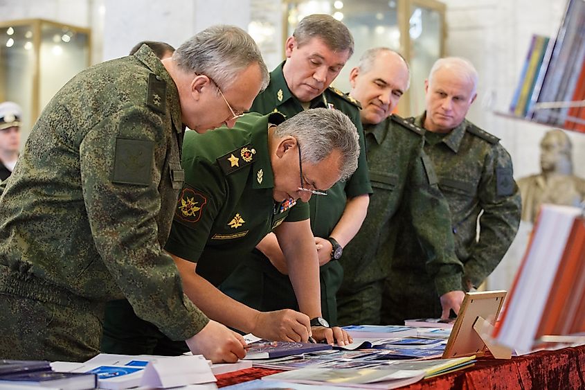 Members of the General Staff Academy gathered around a desk. Credit Wikimeida: Mil.ru