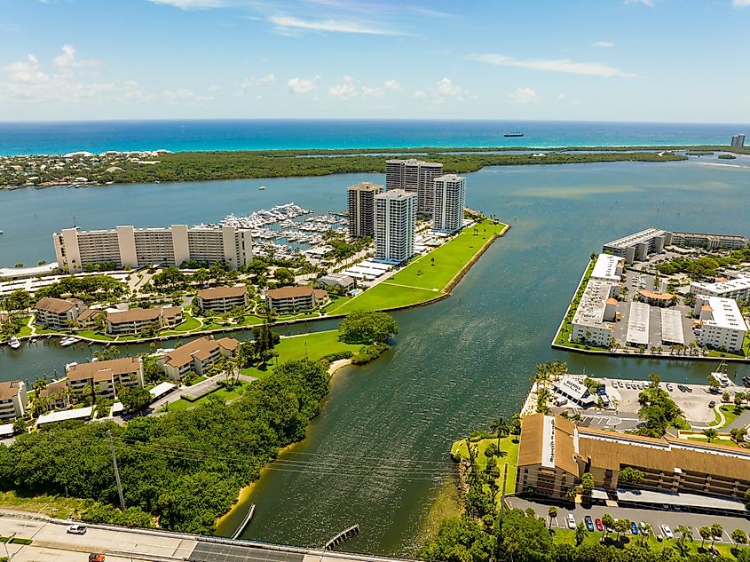 Coastal scene North Palm Beach, FL, inlet and condominium buildings.