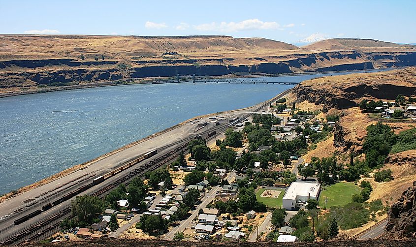 Wishram on the Columbia River with a rail bridge and snowy Mt. Hood.