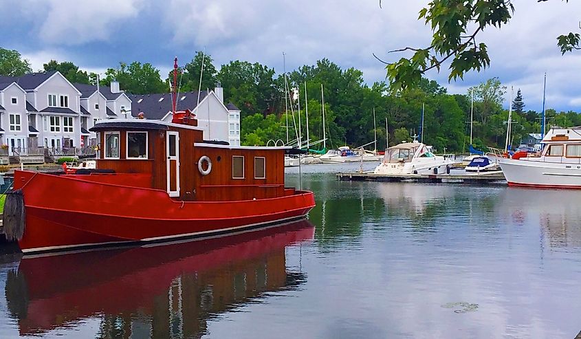 Red boat in the harbour of Picton, Ontario, Canada.