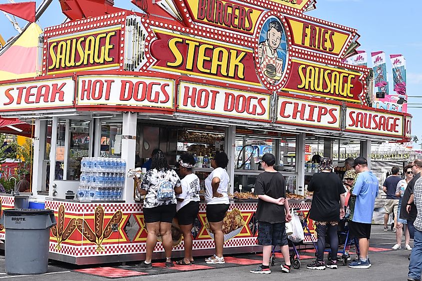 People line up at a hot dog stand at the Delaware State Fair in Harrington, Delaware.