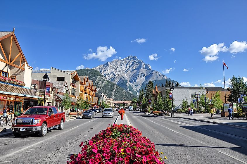 The famous Banff Avenue on a sunny summer day in Banff, Alberta. Image credit Eddy Galeotti via Shutterstock