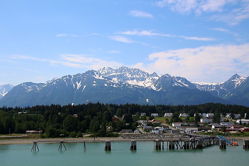 View of Fort William H. Seward from Chilkoot Inlet and mountains in the background, Haines, Alaska, United States.