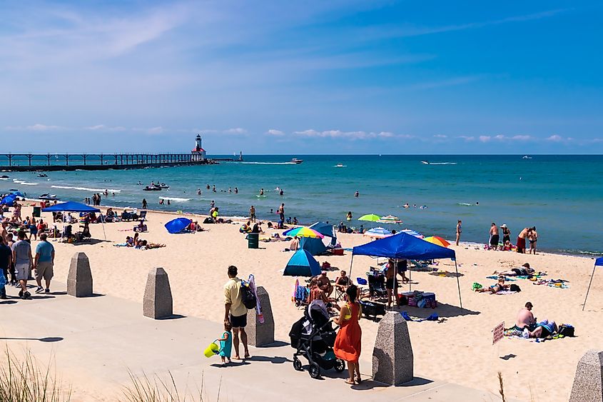 People on the beach in Michigan City, Indiana. Editorial credit: Lewis Photo Studio / Shutterstock.com