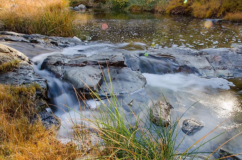 Cache creek, California, flowing over rocks.