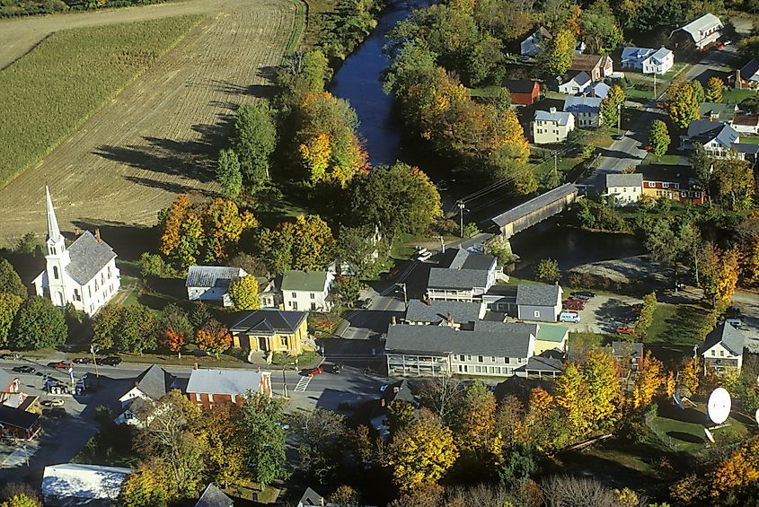 Aerial view of Waitsfield, Vermont, and the Mad River along Scenic Route 100 in autumn.