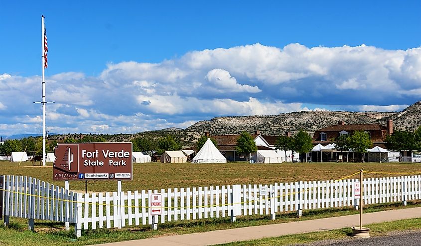 Fort Verde State Park sign at the white fence during Fort Verde Days celebration, Camp Verde, Arizona.